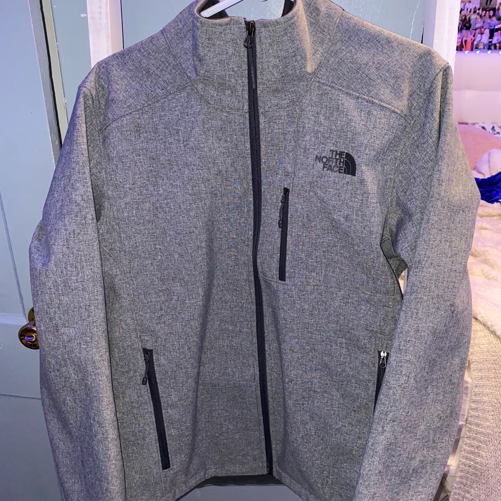 gray northface zip-up jacket